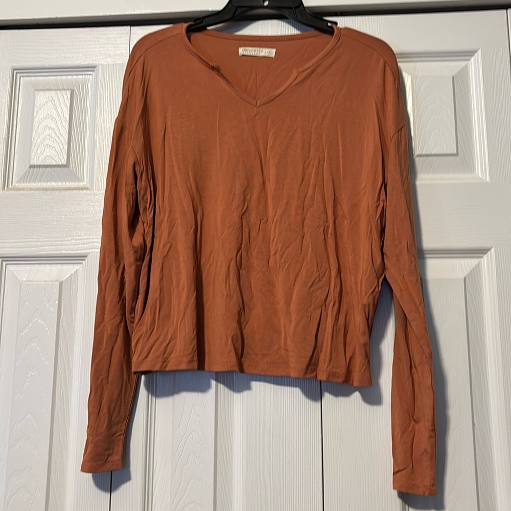 Cropped long sleeve top. New without tags